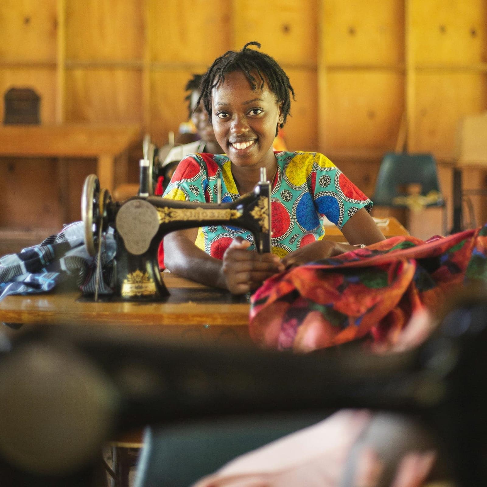 A young woman at a sewing machine during vocational training