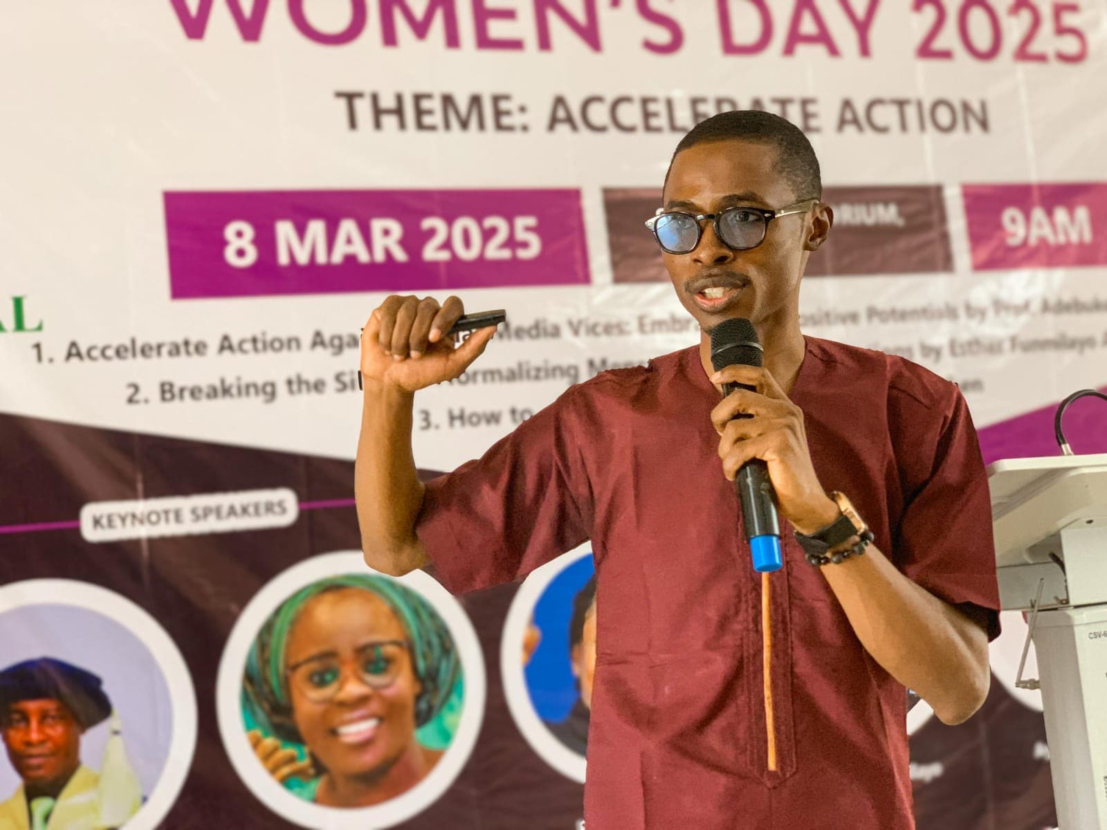 A speaker addressing the audience at the Women's Day program