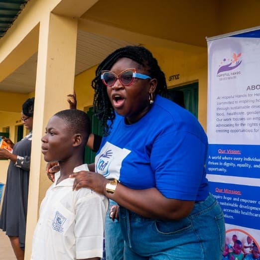 A KHI volunteer speaking with students during Pads & Pals